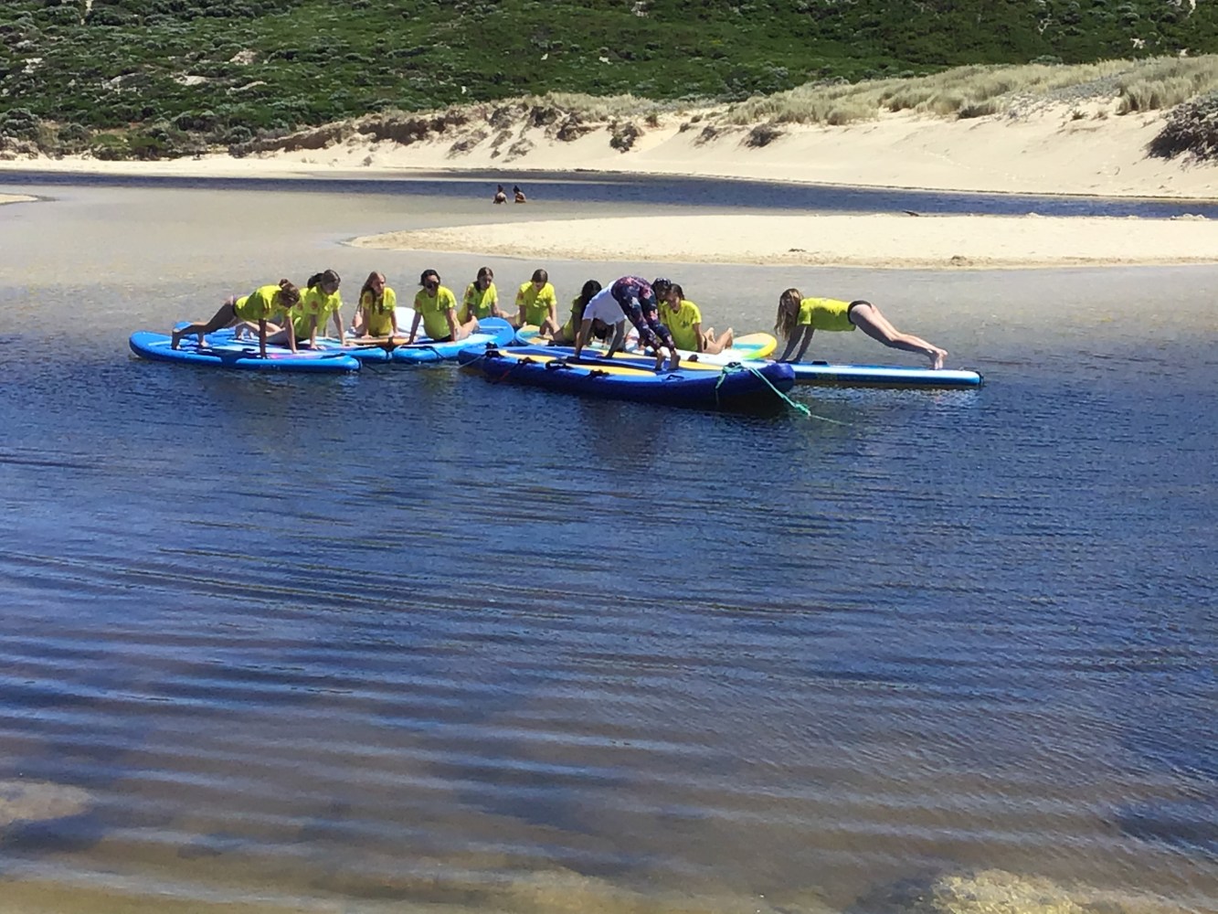 a group of people in a boat on a body of water